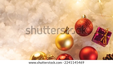Christmas ball on snow background, Christmas background design and bokeh lights.