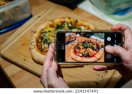 Taking a Photo of selfe made Pizza.
