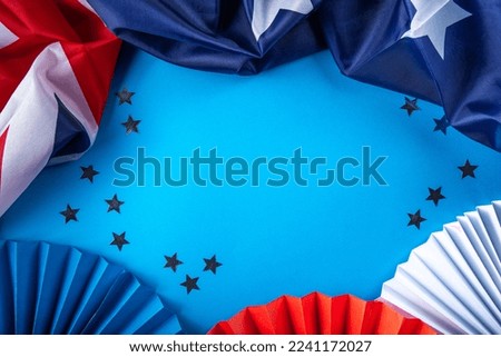Australia Day greeting card Background with australian flag, silver stars, with text Happy Australia day, paper red, blue, white decor, over blue background copy space