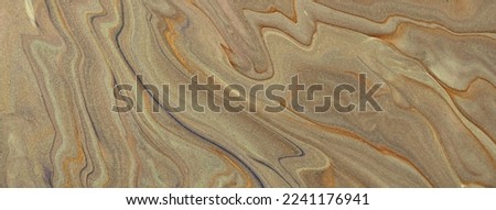 Abstract fluid art background light brown and beige colors. Liquid marble. Acrylic painting with sand lines and gradient. Alcohol ink backdrop with wavy pattern.