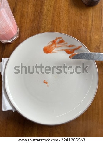 Empty plate ready for slice of pizza pepperoni and strawberry milkshake