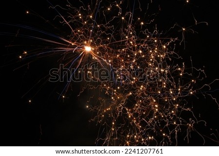Fireworks explode in the night sky to commemorate an event