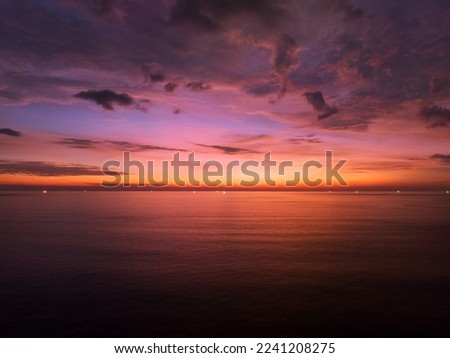 Aerial view sunset sky, Nature beautiful Light Sunset or sunrise over sea, Colorful dramatic majestic scenery Sky with Amazing clouds and waves in sunset sky purple light cloud background Royalty-Free Stock Photo #2241208275