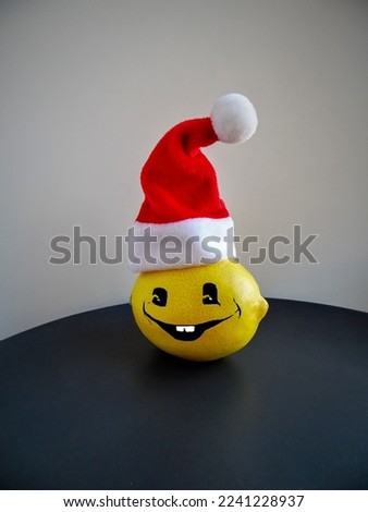 emoticon on a lemon in a New Year's hat, christmas. New Year
