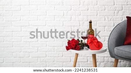 Gift for Valentine's Day, rose flowers and wine on table in room. Banner for design