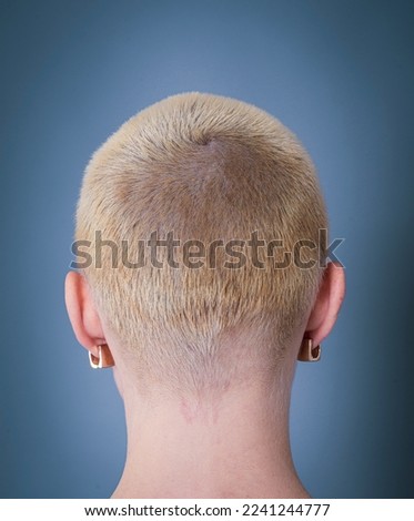 back view of blond short hair woman Royalty-Free Stock Photo #2241244777