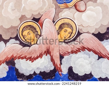 Ancient Fresco with Angels on the Walls of a Orthodox Church  Royalty-Free Stock Photo #2241248219