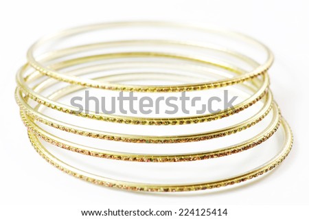 Golden bracelet isolated on white background.