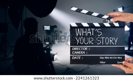 What's your story, Handwriting on film slate or clapperboard .film crew working in the studio.