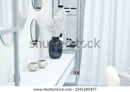 Table with decor in the office of a beauty specialist. Stylish interior. Horizontal photo