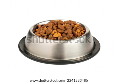 Food for cats and dogs in a bowl on a white background.