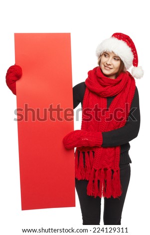 Christmas, X-mas, Xmas sale, shopping concept - Smiling woman wearing Santa hat with red sale sign, looking at blank copy space at banner