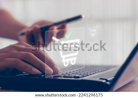 Online shopping concept. shopping order in online store, payment makes a purchase on the Internet, Online payment, Business financial technology. concept on virtual screen with hand typing on keyboard Royalty-Free Stock Photo #2241296175