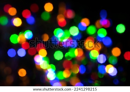 Abstract Christmas light on black background.