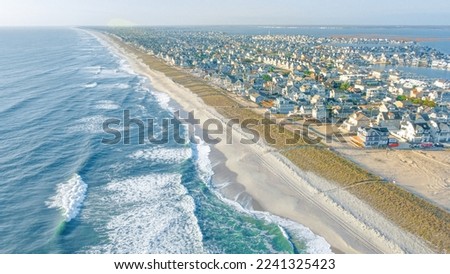 Aerial views of the beautiful blue  ocean water along the jersey shore Royalty-Free Stock Photo #2241325423