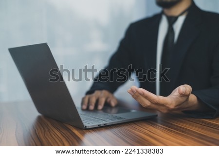 People using computer Side view of male hands typing on laptop keyboard