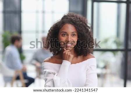 Portrait of an African American young business woman working in the office