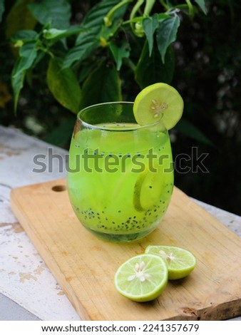 Es melon. Indonesian cocktail made from melon, syrup, basil seeds, and lime. Perfect for recipe, catalogue, articles or any cooking contents.  Royalty-Free Stock Photo #2241357679