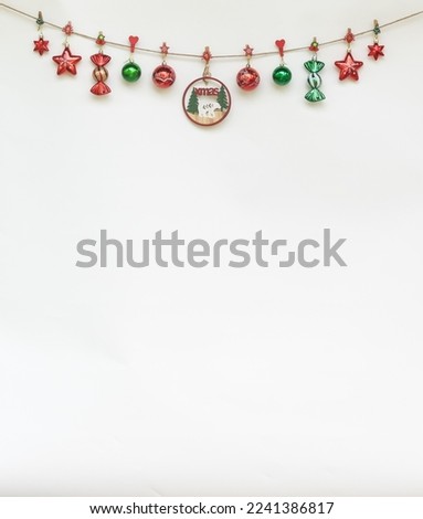 Christmas  decorations  with  ornament hanging  on the  rope  with  white  background  for  Xmas  Day  and  Happy  New  Year  Concept .