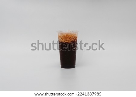 A sweet, bright drink made from coffee mixed with milk, ice, syrup.