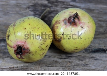 Fresh pomegranate close up picture on the wooden background. Healthful natural fruits for cancer patient