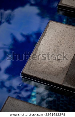 Black Stone At Swimming Pool