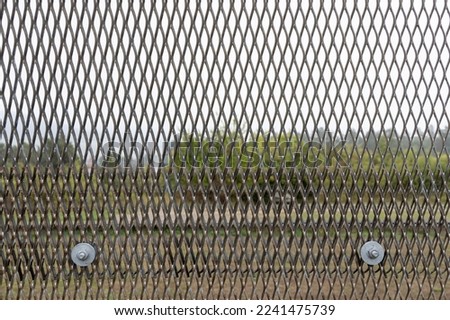 Closeup metal border fencing Museum Point Alpha US military base in Geisa in Thuringen in Germany Royalty-Free Stock Photo #2241475739