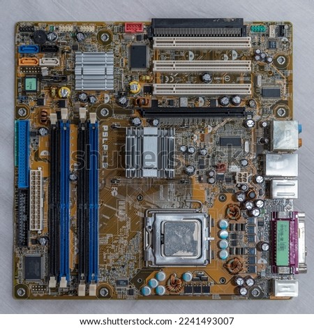 Computer part motherboard shows hardware parts processor, slots, capacitor, chip
