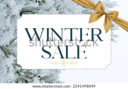 Winter sale text on white frame - Snow covered pine tree branch background - Yellow gold bow