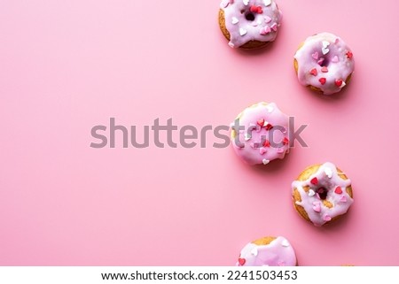 valentines day concept. Small donuts isolated on pink background