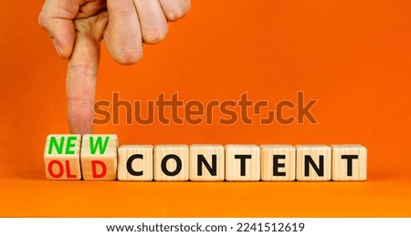 New or old content symbol. Concept words New content and Old content on wooden cubes. Businessman hand. Beautiful orange table orange background. Business New or old content concept. Copy space.
