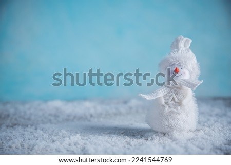 a snowman in the snow. New Year's, Christmas winter background with copy space