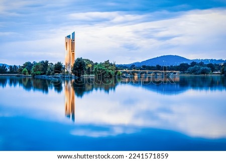 Gorgeous cityscape of the National Carillon at sunset over Lake Burley Griffin, Canberra, Australia Royalty-Free Stock Photo #2241571859
