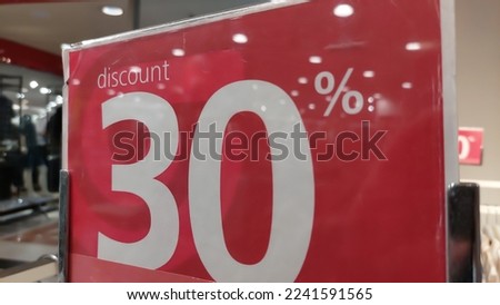 Jakarta, Indonesia December 24, 2022 : A 30% discount marker at the end of the year at a mall