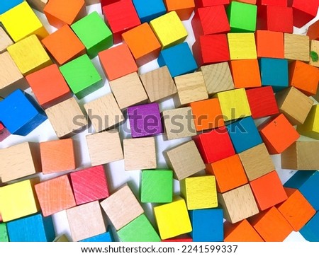 The colorful wooden cube featured in the picture is a single purple wood.