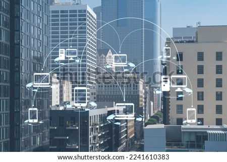 Panorama cityscape of Los Angeles downtown at day time, California, USA. Skyscrapers of LA city. Glowing Social media icons. The concept of networking and establishing new connections between people