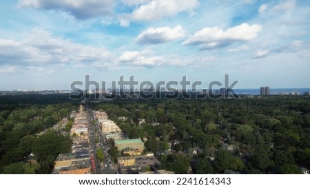 Aerial view over Bloor Street West in the Kingsway neighborhood of Toronto, Ontario, Canada. Looking southeast towards the downtown core Toronto skyline, Mimico and Lake Ontario.

