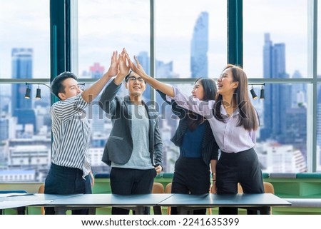 Team of young Asian entrepreneurs and startup have business meeting and encouraging each other for good spirit energy to accomplish successful marketing plan Royalty-Free Stock Photo #2241635399