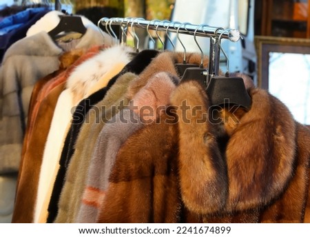 fur Coaat and winter clothing for sale at outdoor market
