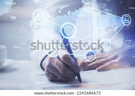 Man's hands working with notes background. Social networking concept. Crowd sourcing. Global business. Multi exposure.