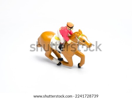 jockey riding a horse toy