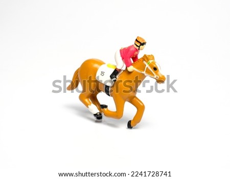 jockey riding a horse toy