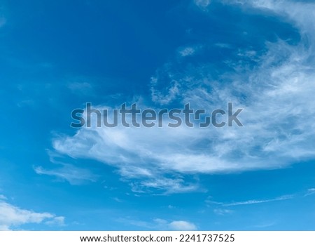 The blue sky background Contains Cirrus Clouds, Cirrostratus Clouds, and Cumulus Clouds due to good weather at Thailand.no focus Royalty-Free Stock Photo #2241737525
