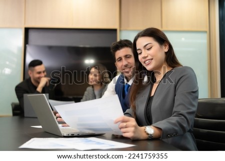 New business people in the conference room are exchanging information with each other along with rehearsing important information before presenting work and new projects to the management team Royalty-Free Stock Photo #2241759355