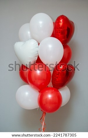 red and white balloons on the background of the wall, a set of red balloons.