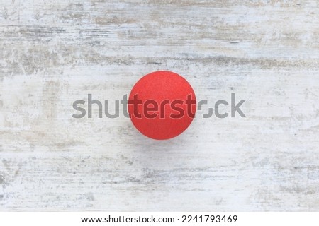Red Nose Day, red nose on wooden background
