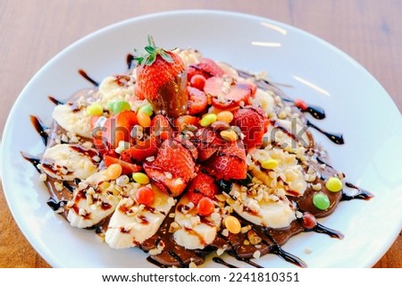 Delicious waffle with chocolate sauce  Royalty-Free Stock Photo #2241810351