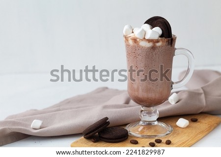 chocolate with whipped cream.Hot chocolate on the cutting board with marshmallow and cookies. Winter and autumn time. Christmas drink on the white background. copy space. Viennese Coffee