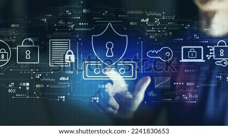 Cyber security theme with young man touching a digital screen at night