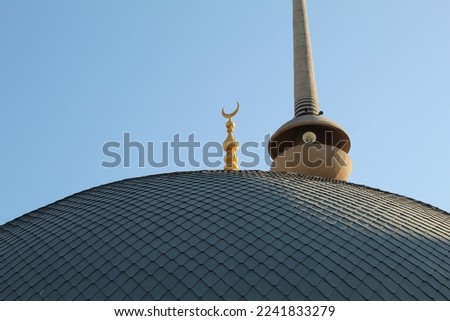 A golden crescent at the top of a mosque. Icon of islam. High quality photo
